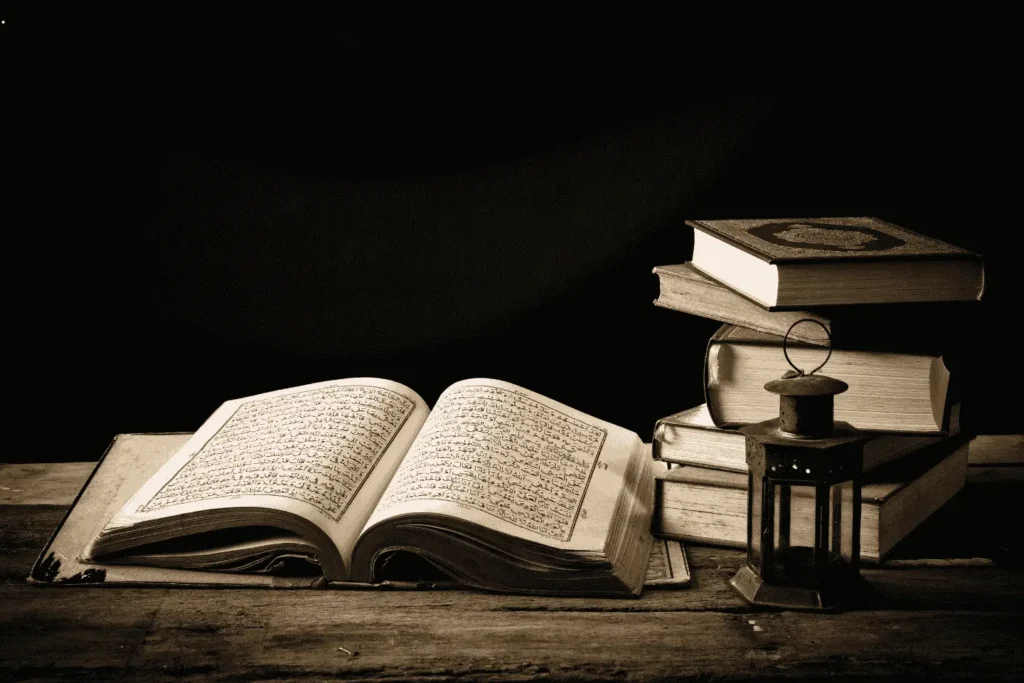 Old Quran books on table representing online Tafseer course and Quran Tafseer classes for deep understanding in USA and UK